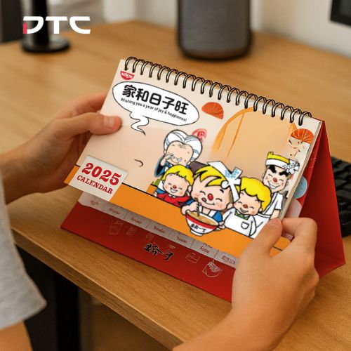 Custom-designed Nissin 2025 calendar featuring festive illustrations and branded elements