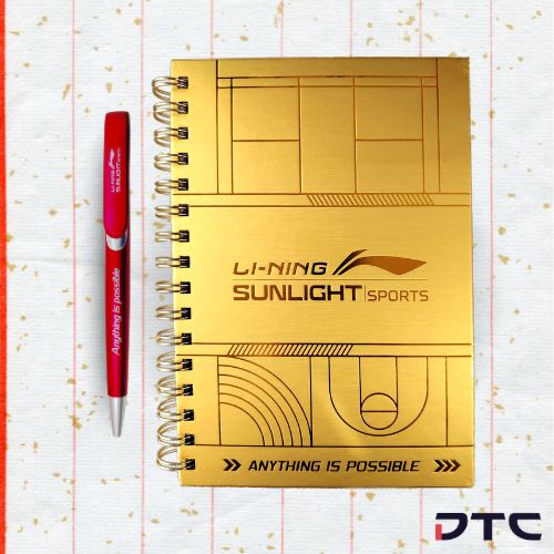 Li-Ning 2024 Chinese New Year premium gift set with gold foil notebook, pen, pin badges, and red packet holder.